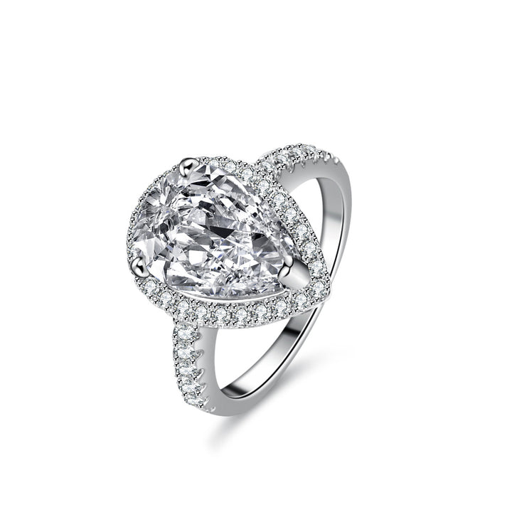 Silver ring with a large heart-shaped gemstone on a white background