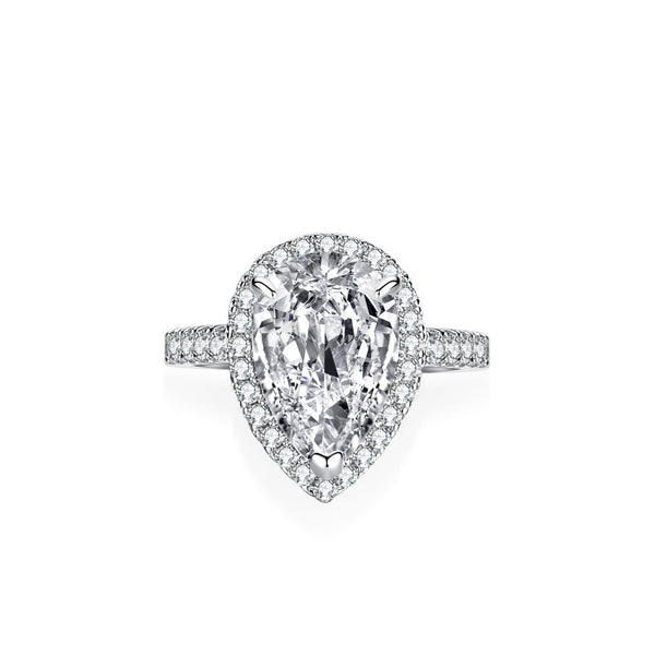 Diamond ring with pear-shaped center stone on a white background
