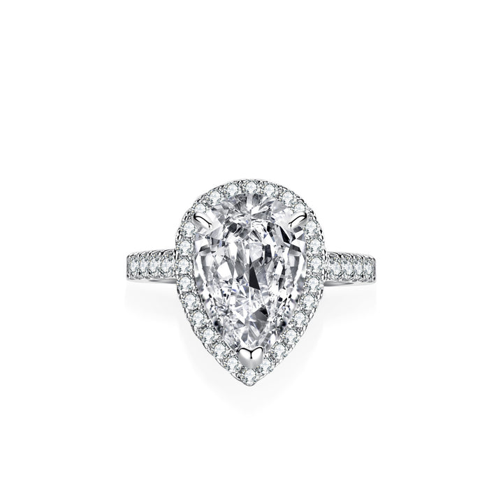 Diamond ring with pear-shaped center stone on a white background